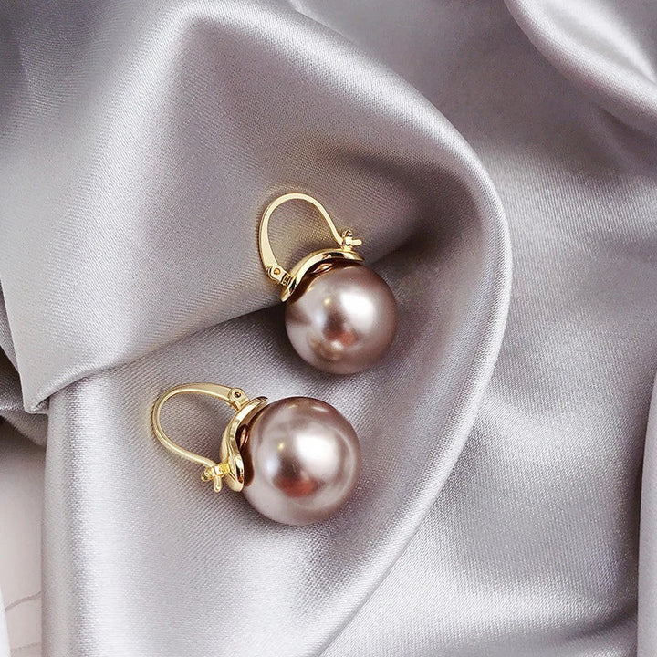 Gouden oorbellen met dikke parels