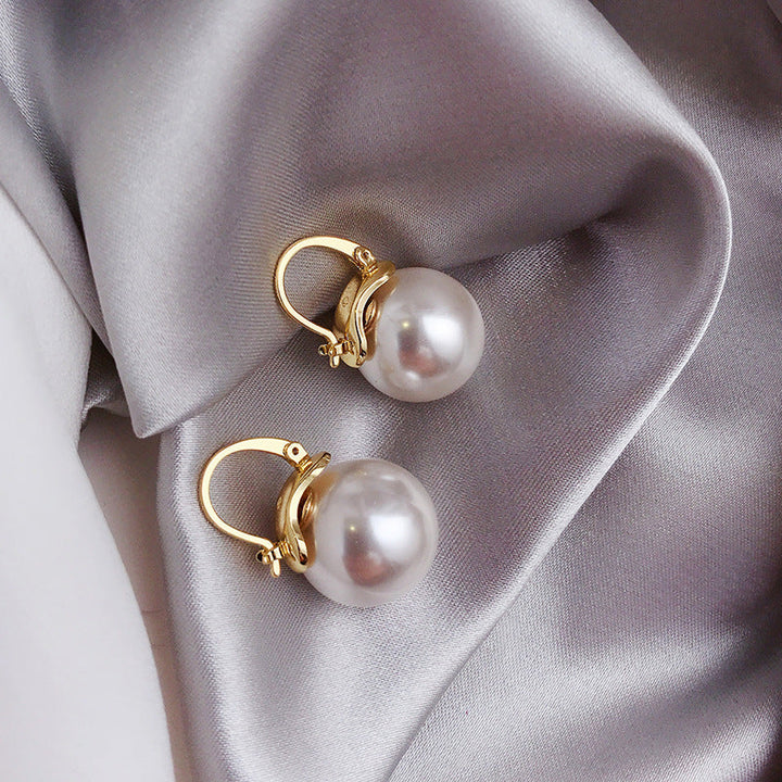 Gouden oorbellen met dikke parels