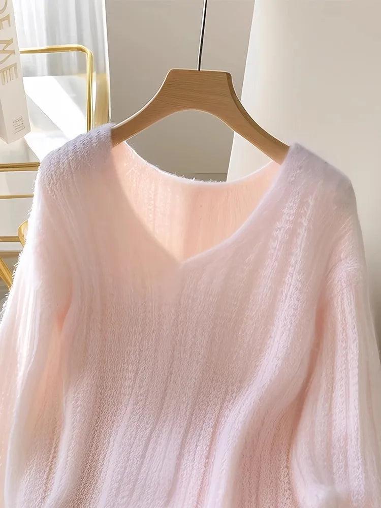 Roze pullover en gebreide lange mouwen zonder patroon
