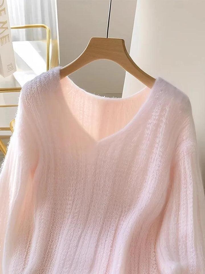 Roze pullover en gebreide lange mouwen zonder patroon