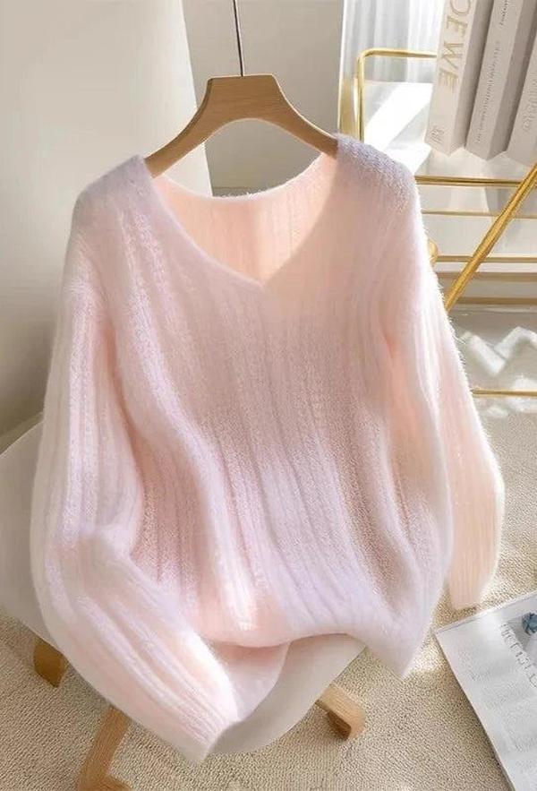 Roze pullover en gebreide lange mouwen zonder patroon