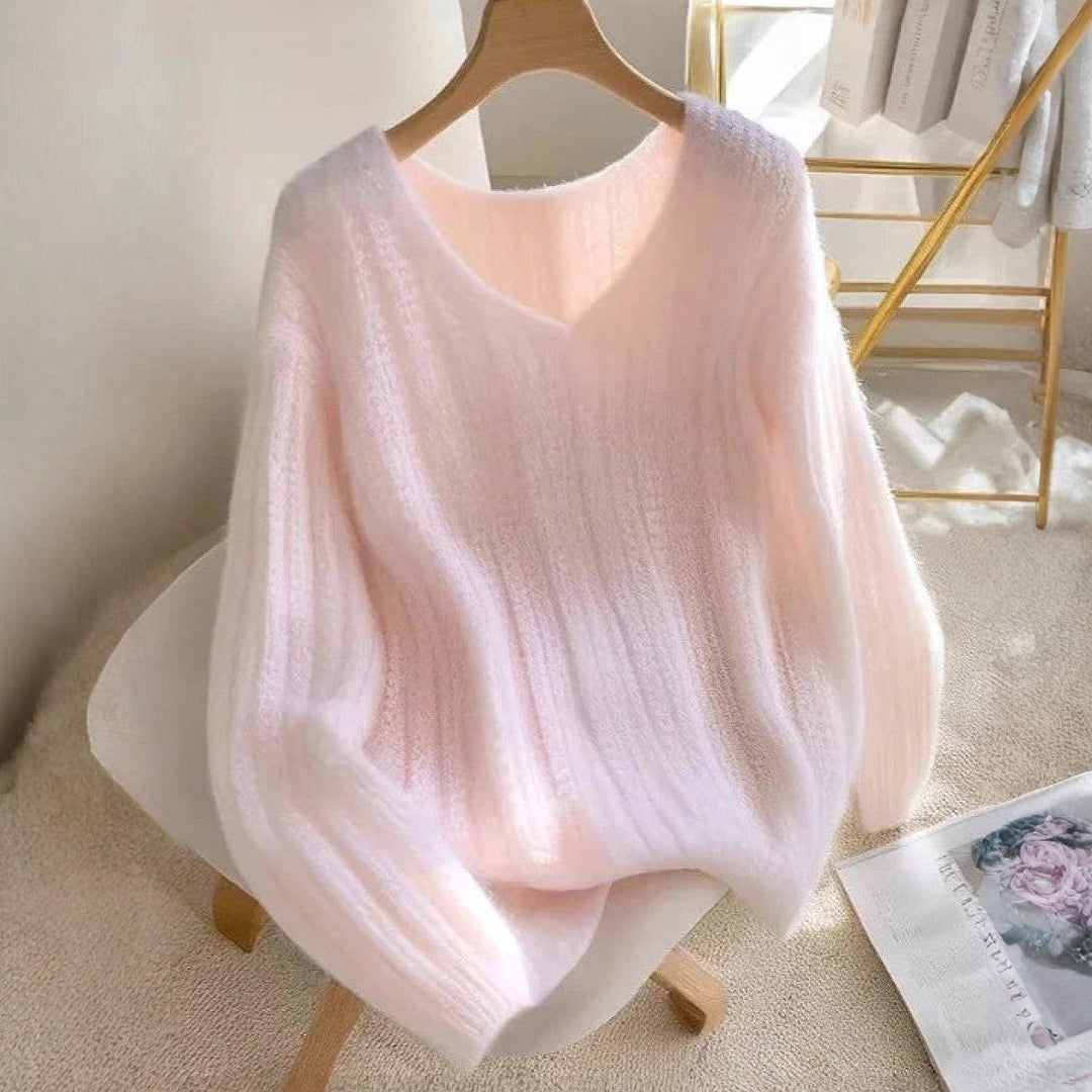 Roze pullover en gebreide lange mouwen zonder patroon