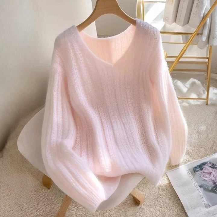 Roze pullover en gebreide lange mouwen zonder patroon